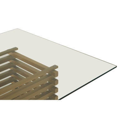 Close-up of the clear glass top edge resting on the gold frame