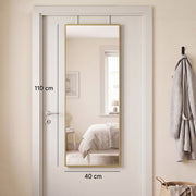 Door-hung mirror reflecting a bed, with 110 cm by 40 cm dimensions marked