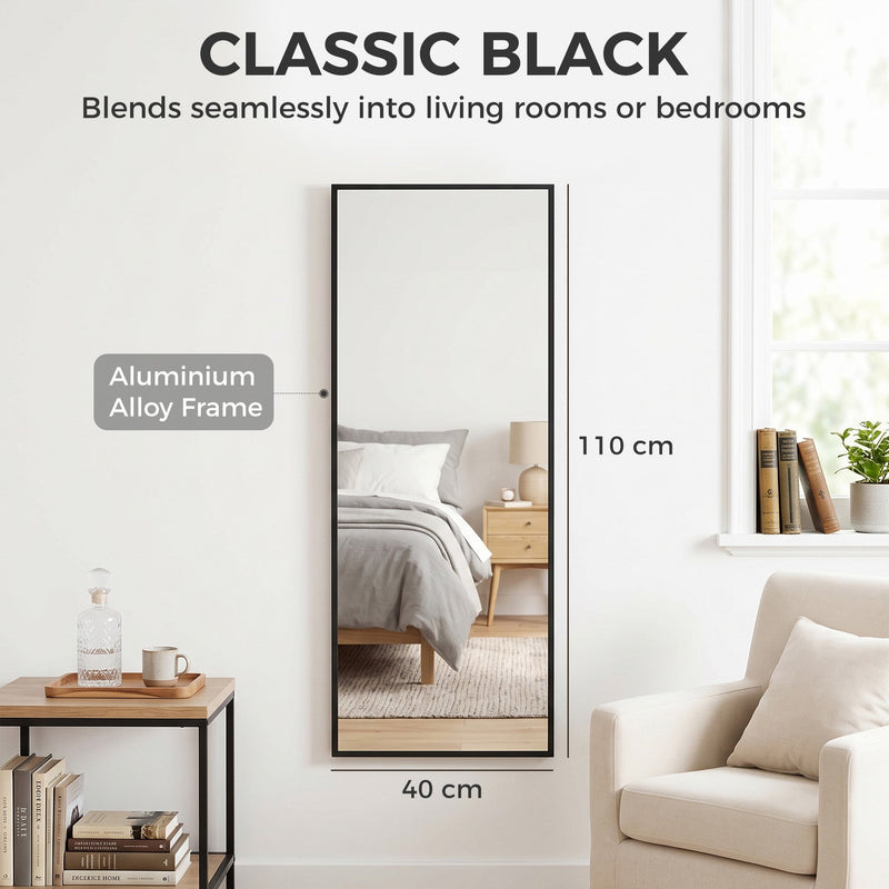 Mirror on a bedroom wall with aluminium alloy frame labelled, 110 cm tall and 40 cm wide