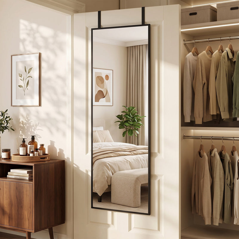 Over-door mirror hanging beside a walk-in wardrobe with folded clothes