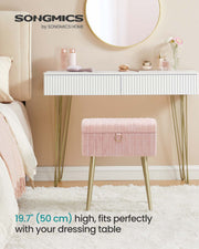 Pink vanity stool tucked under a white dressing table, standing 50 cm tall
