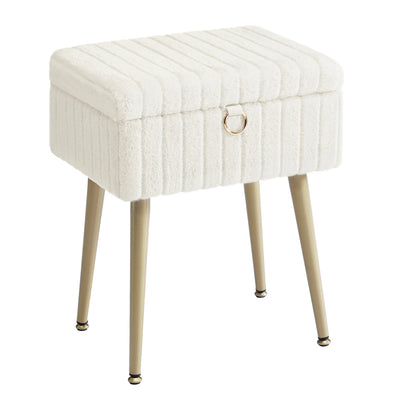Cream white plush vanity stool with a ribbed lid, gold ring pull and four tapered gold metal legs on a plain background