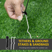 Ground stake and tether rope being fixed into grass, with a rope coil and stakes shown
