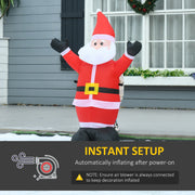 Inflatable Santa outside a grey house with an instant setup panel