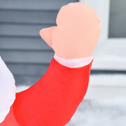 Close-up of the Santa waving mitten against a grey wall