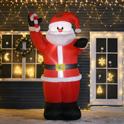 Inflatable Santa lit up at night in front of a dark house with string lights and lit windows