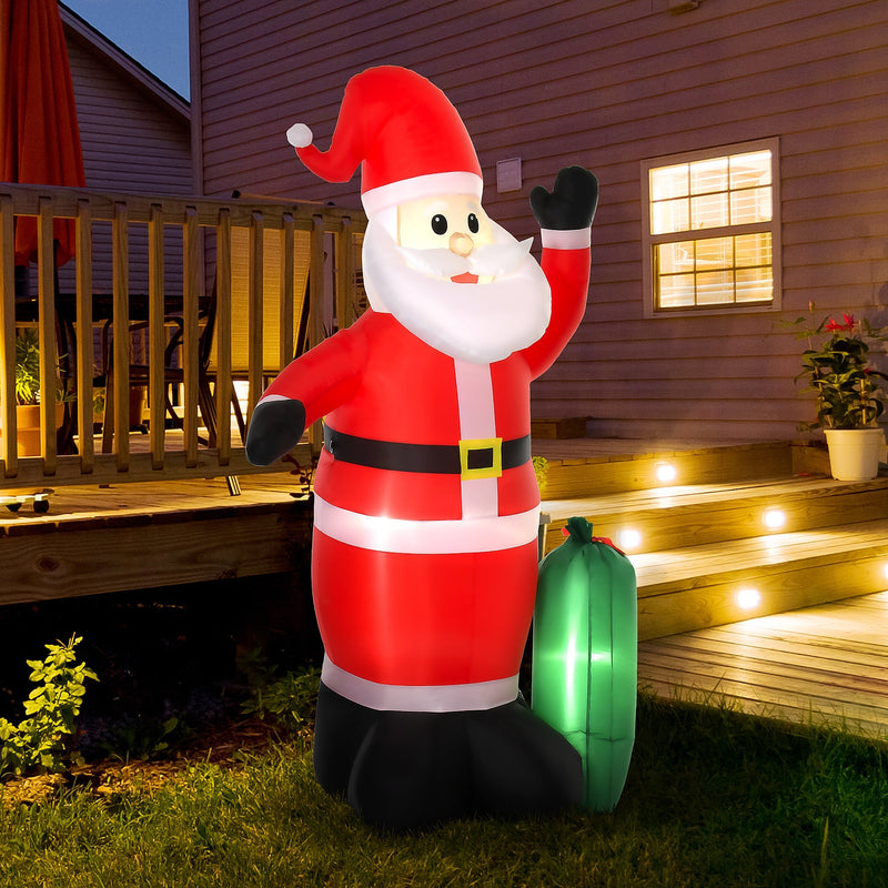 Inflatable Santa lit up at dusk beside a wooden deck and garden steps