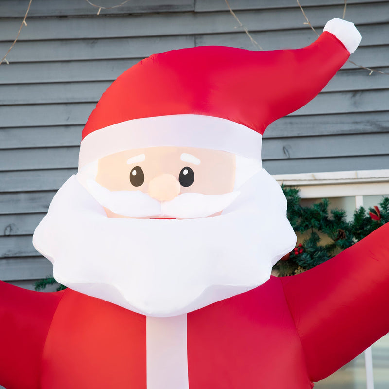 Close-up of the inflatable Santa face and hat against a grey clapboard wall