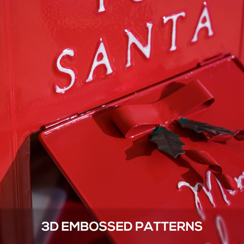 Close-up of the raised white lettering and holly embossing on the red postbox door