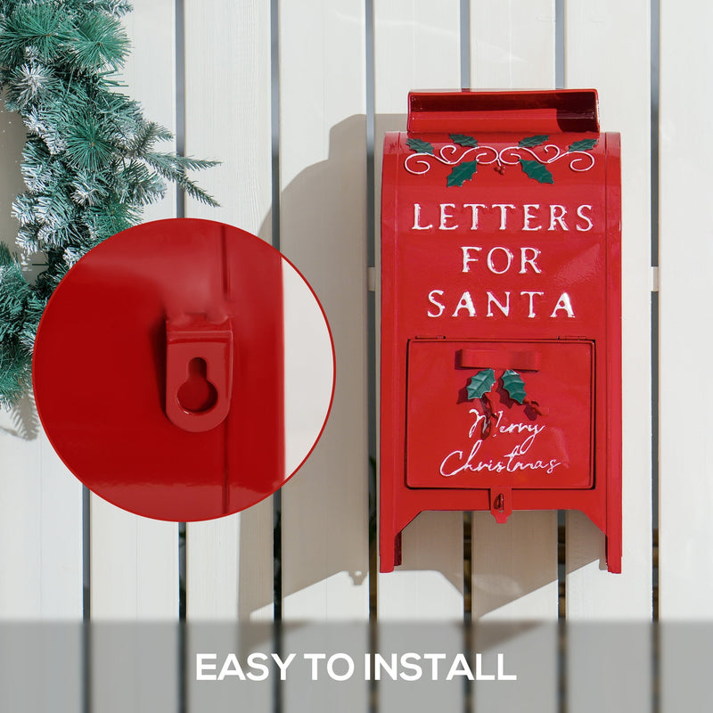 Red Santa postbox hung on a white fence with a close-up of the keyhole wall hanger