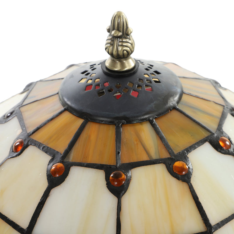 Close-up of the stained glass shade top with finial and amber bead details