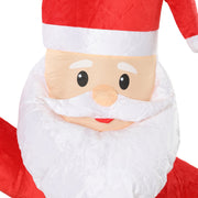 Close-up of the Santa's face, white beard and red hat in velvet look fabric