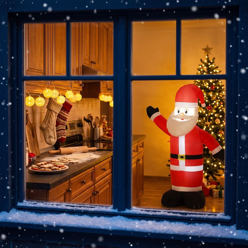 Lit Santa seen through a window beside a decorated Christmas tree