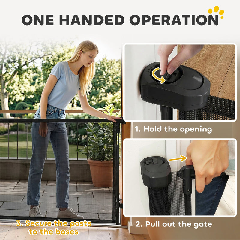 Woman opening the black dog gate with one hand using the release button