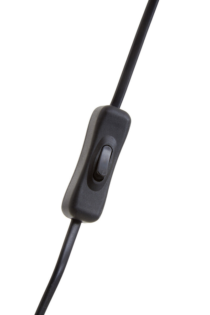 Close-up of black metal base on ribbed glass table lamp