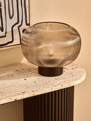 Ribbed glass globe lamp in a warm interior