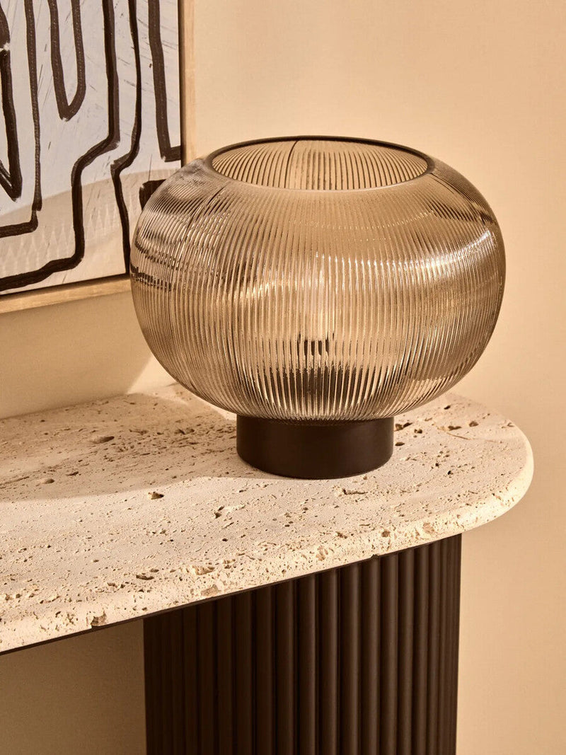 Ribbed glass globe lamp in a warm interior