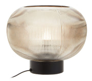 Ribbed smoked glass globe lamp with black metal base on a plain background