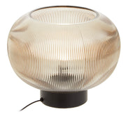 Ribbed glass globe table lamp with black base, angled view