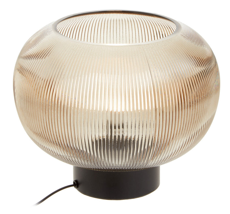Ribbed glass globe table lamp with black base, angled view