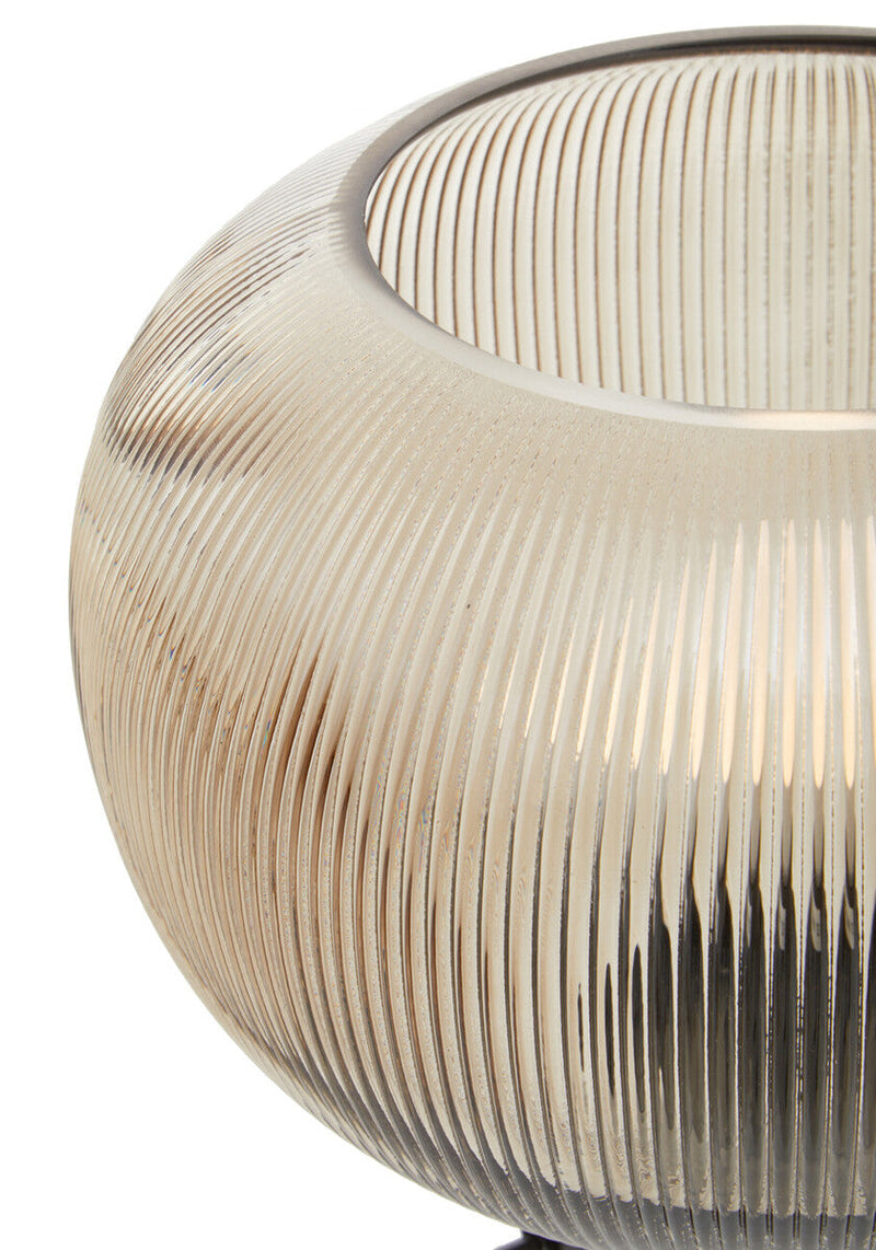 Close-up of ribbed texture on smoked brown glass lamp shade