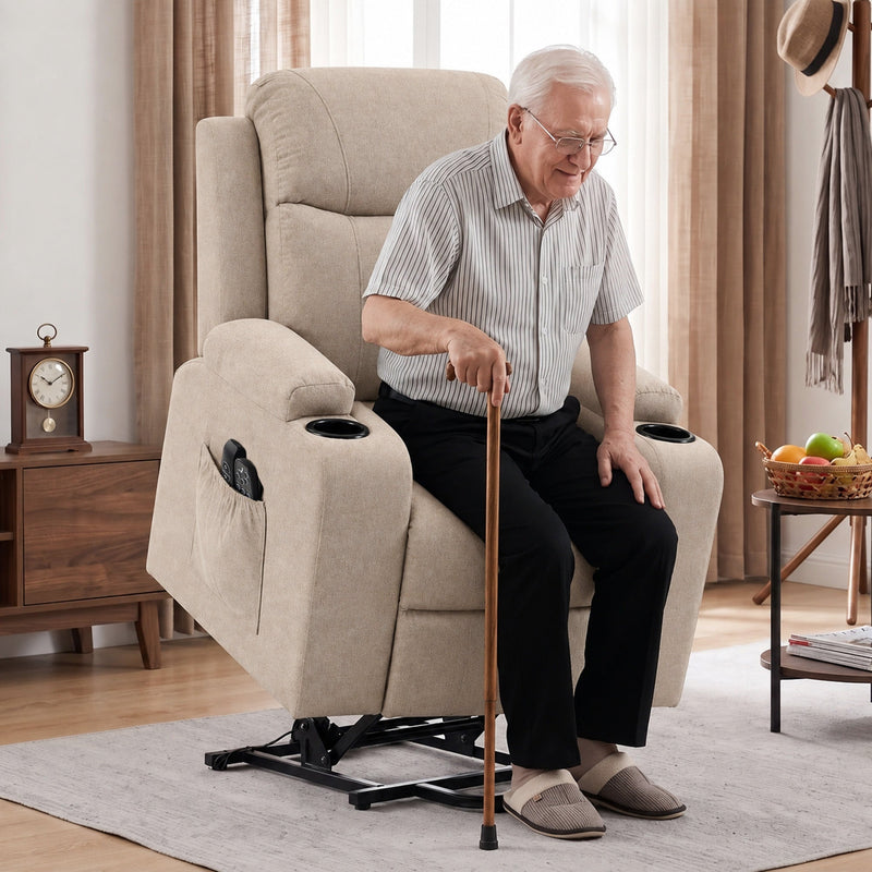 Older man seated with a cane in the beige riser recliner while it is raised on its lift base