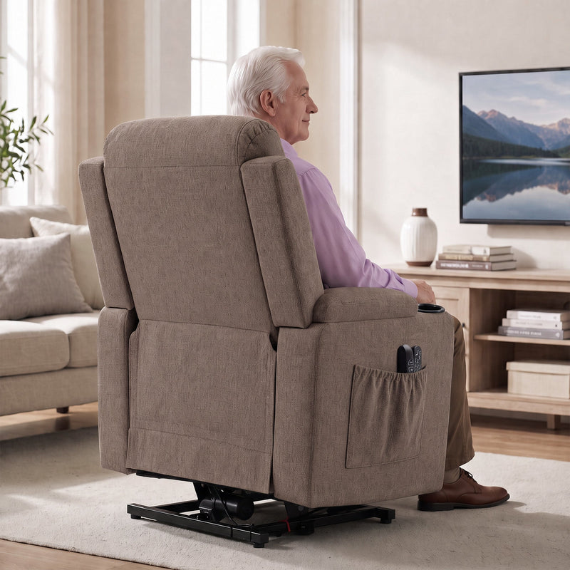 Rear view of the brown riser recliner with a side pocket, with a man seated watching TV