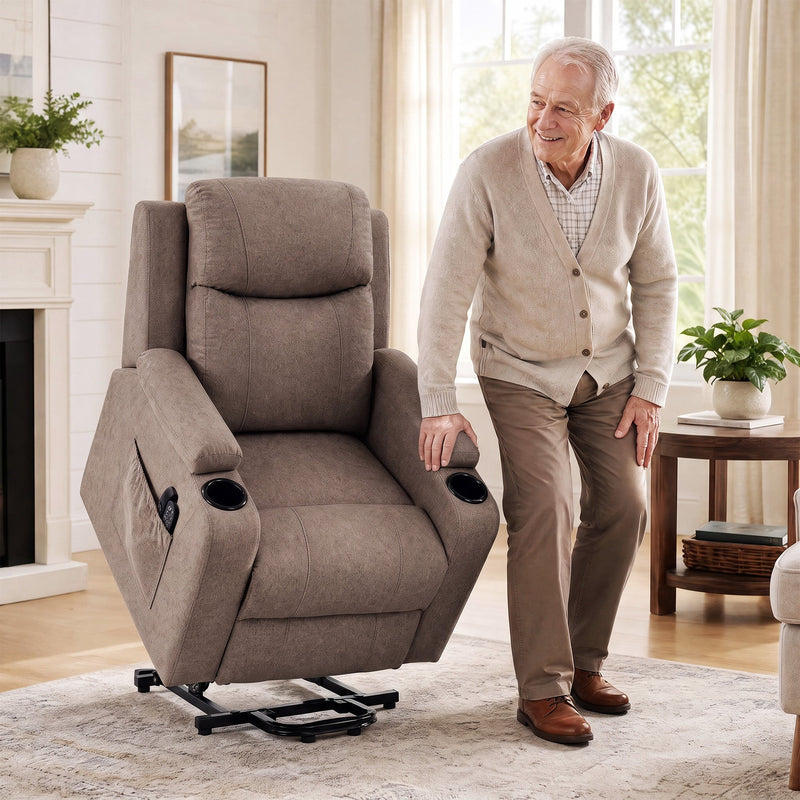 Older man standing beside the brown riser recliner raised on its lift base