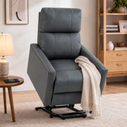 Dark grey riser recliner chair in a living room with a throw blanket