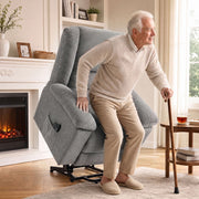Older man with a walking stick using the 45° power lift to stand up from the riser recliner