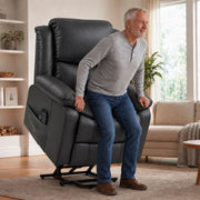 Man using the riser recliner's lift to stand up from the chair in a living room