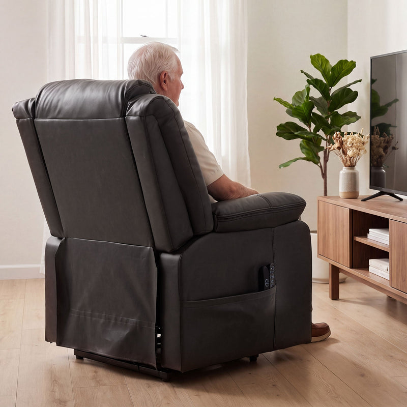 Rear view of the riser recliner with a man watching TV beside a plant