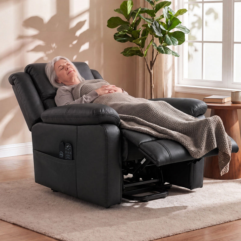 Woman reclined in the chair under a blanket with the footrest raised