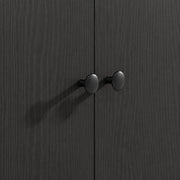 Close-up of the two round door knobs on the cabinet