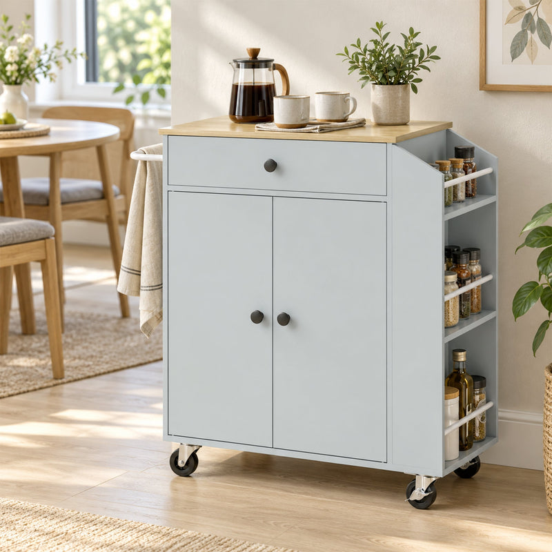 Kitchen trolley by a window holding a coffee maker and potted plant