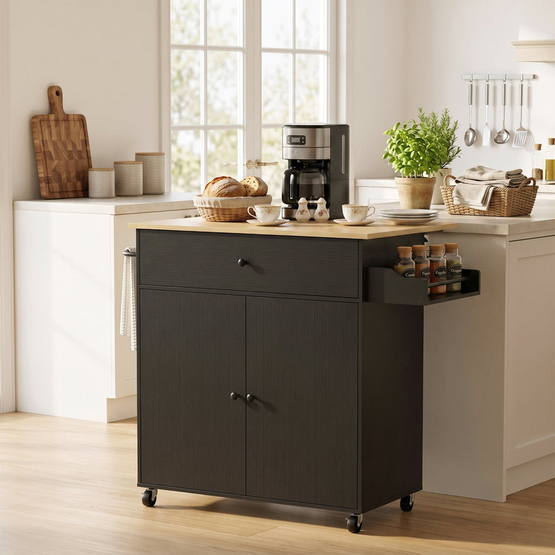 Black kitchen island used as a coffee station with a coffee maker and spice jars