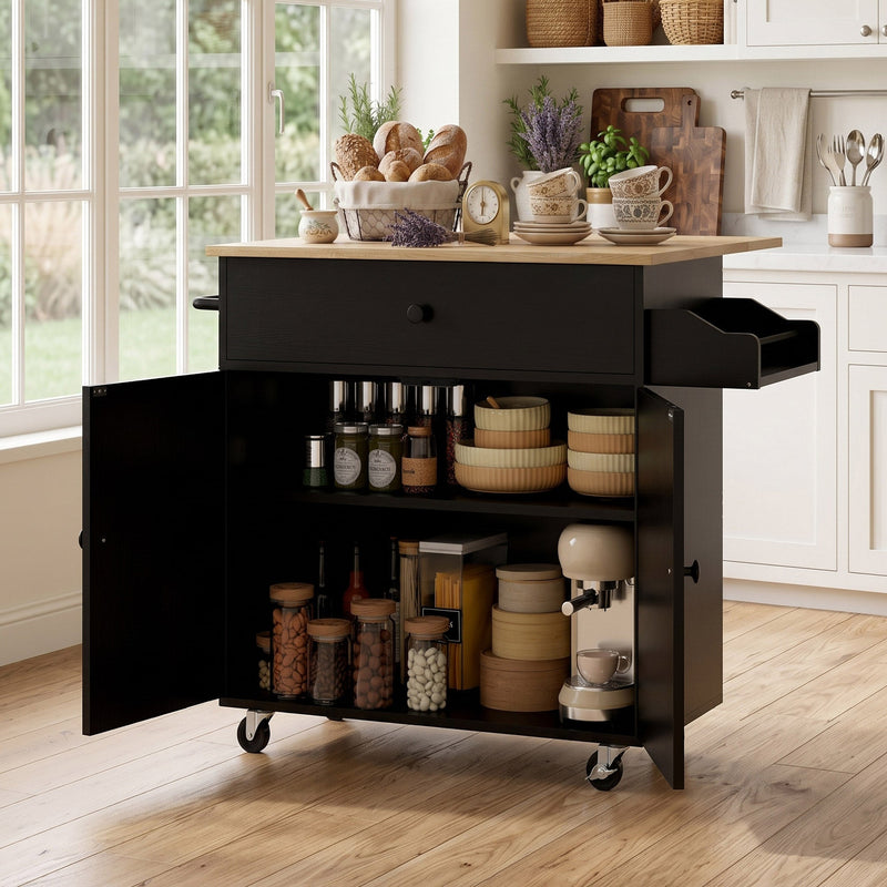 Black kitchen island with cabinet open showing jars, bowls and a stand mixer stored inside