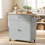 Grey kitchen island in a kitchen with a stand mixer and spice jars on the spice rack