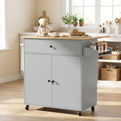 Grey kitchen island in a kitchen with a stand mixer and spice jars on the spice rack