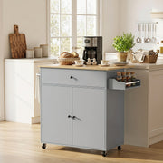 Grey kitchen island used as a coffee station with a coffee maker and spice jars