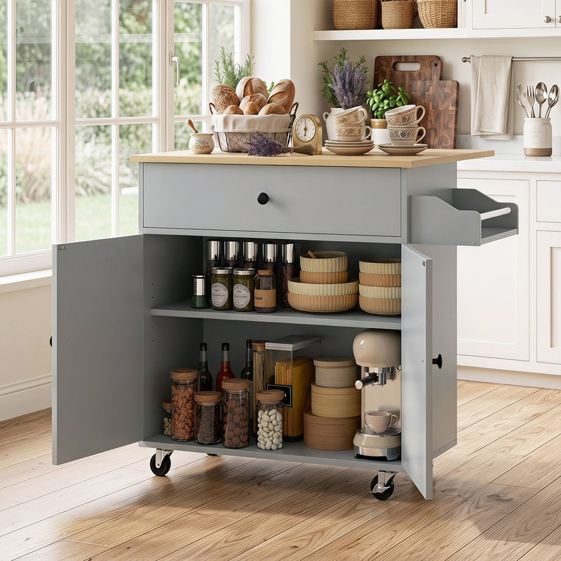 Grey kitchen island with cabinet open showing jars, bowls and a stand mixer stored inside