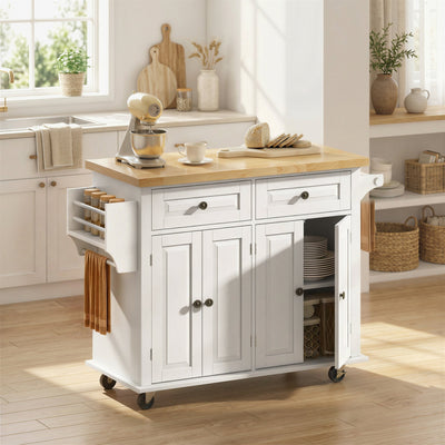 Cream white kitchen island styled in a kitchen with drawers and cabinet open