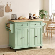 Kitchen island styled in a dining area next to a wooden table and chairs