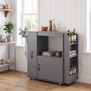 Grey kitchen trolley in a kitchen with cookware and utensils on the open shelf