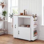 White kitchen trolley in a kitchen with cookware and utensils on the open shelf