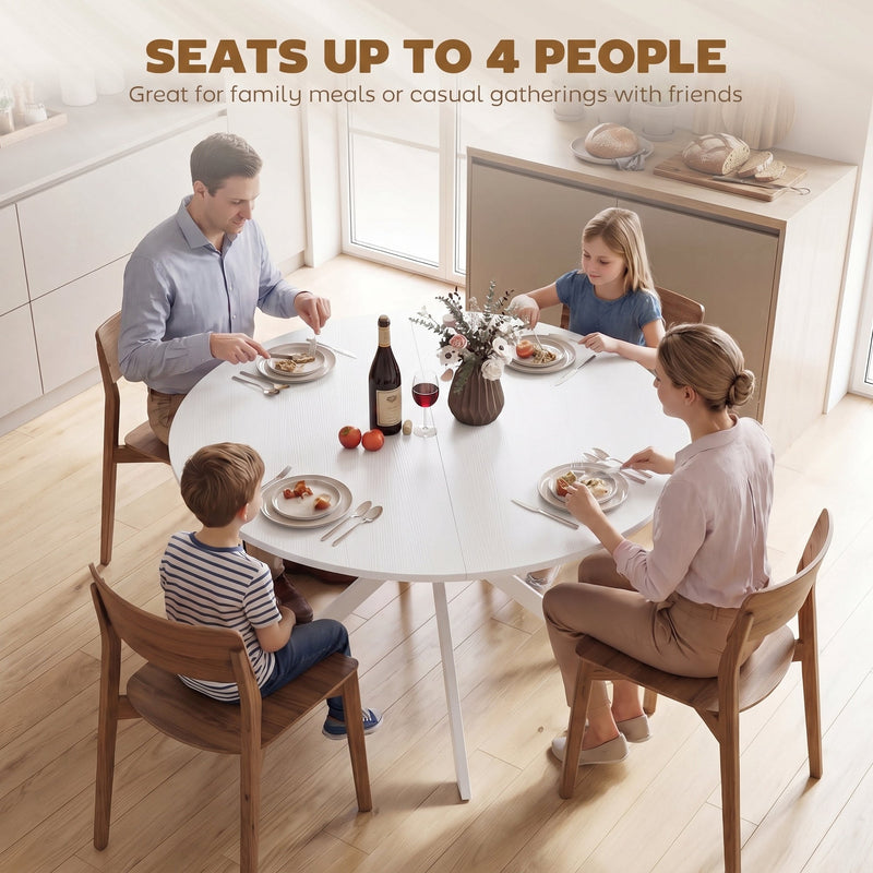 Family of four seated around the round table for a meal