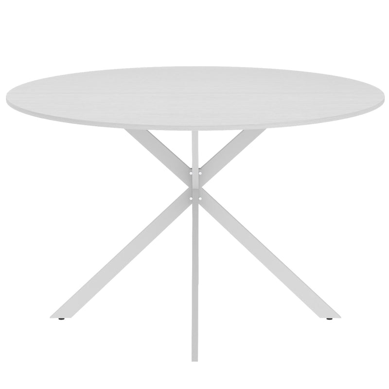 Side view of the white round tabletop above the crossed legs