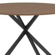 Close-up of the crossed black steel legs meeting under the wood-effect top