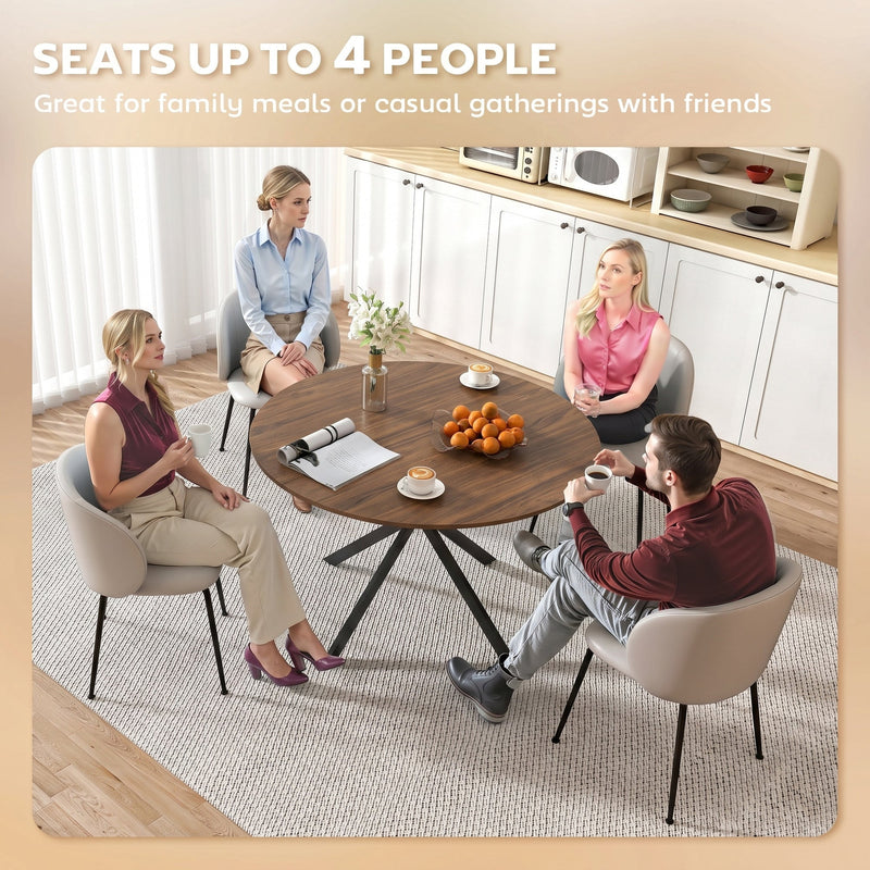 Four people seated around the round dining table