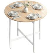 Round folding table with white legs set with four place settings and a vase